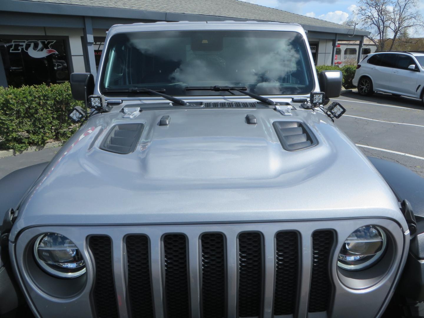 2021 SILVER /BLACK Jeep Wrangler Unlimited Rubicon (1C4HJXFG7MW) with an 3.6L V6 DOHC 24V FFV engine, 6A transmission, located at 2630 Grass Valley Highway, Auburn, CA, 95603, (530) 508-5100, 38.937893, -121.095482 - Features - Zone Offroad 3" Lift kit, Fox shocks, 37" Nitto Ridge Grappler tires, 17" Fuel Piston wheels, Warn winch, KC led lights, Voswitch switches, Teraflex HD tire relocation, Fire extinguisher, High Lift Jack, Shovel, Axe, Jumper Cables, and flat towable. - Photo#11